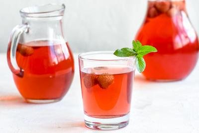 Kompot beverage in a jar and a cup