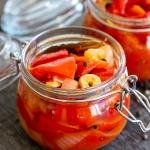 marinated bell peppers in a jar, another one in the background