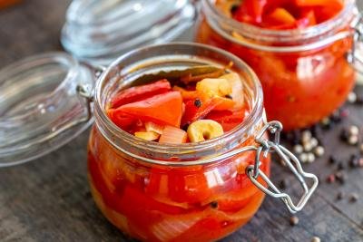 marinated bell peppers in a jar, another one in the background