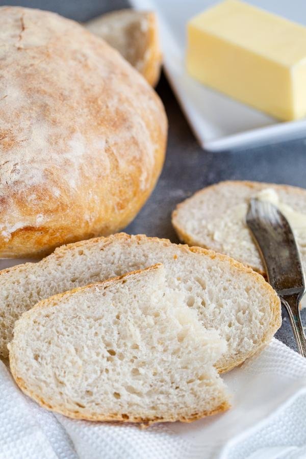 bread slice with butter in background