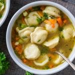 Pelmeni soup in a bowl