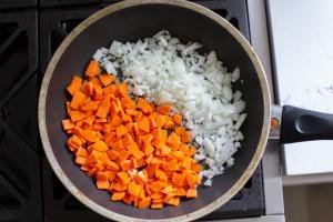 Carrots and onion in a skillet
