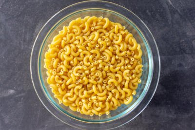 Uncooked noodles in a bowl.