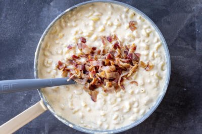 Bacon added to mac and cheese.