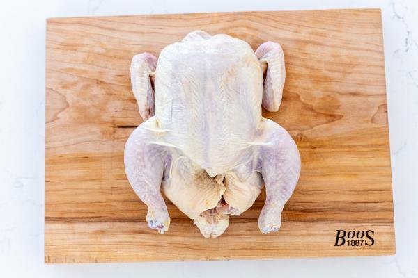 Whole chicken on a cutting board