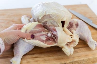 whole chicken getting cut up