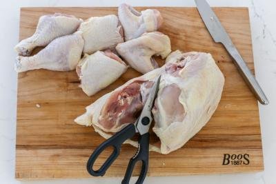 whole chicken getting cut