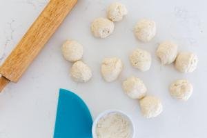 Pieces if dough with a rolling pin