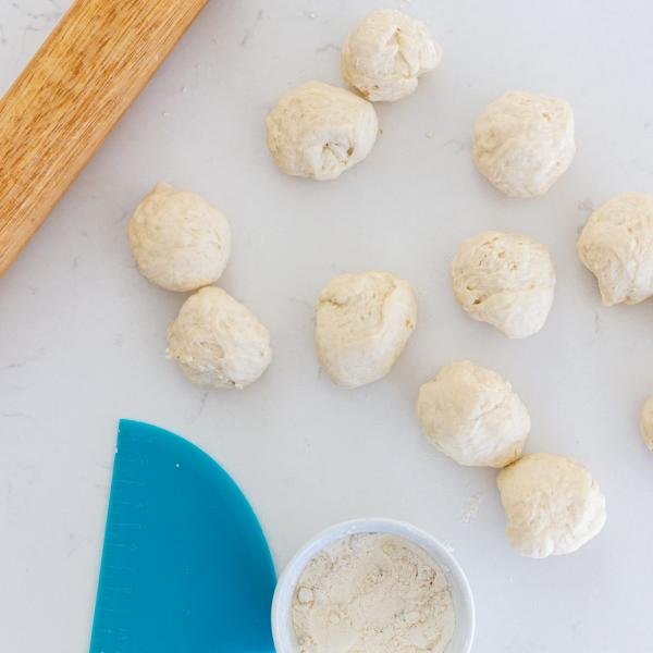 Pieces if dough with a rolling pin