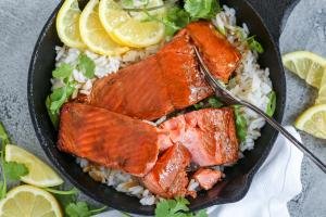 Brown Sugar Glazed Salmon in a skillet with rice