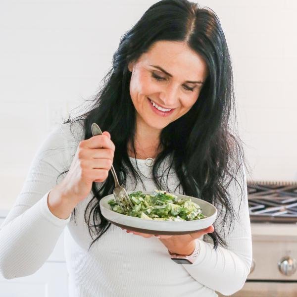Natalya with the plate of Creamy Cucumber Salad