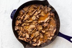 Sauce with beef in a cooking pan