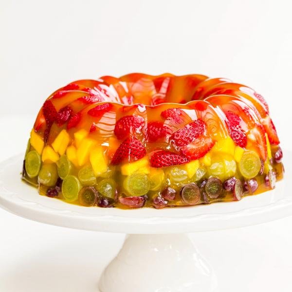 Jello Fruit Cake Dessert on a cake stand