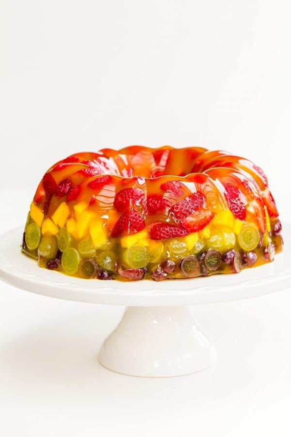 Jello Fruit Cake Dessert on a cake stand