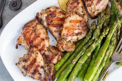 Grilled chicken on a plate with asparagus