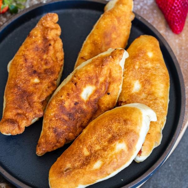 Friend fruit piroshki in a plate