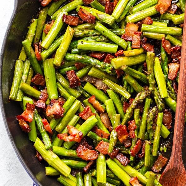 asparagus and bacon in a frying pan