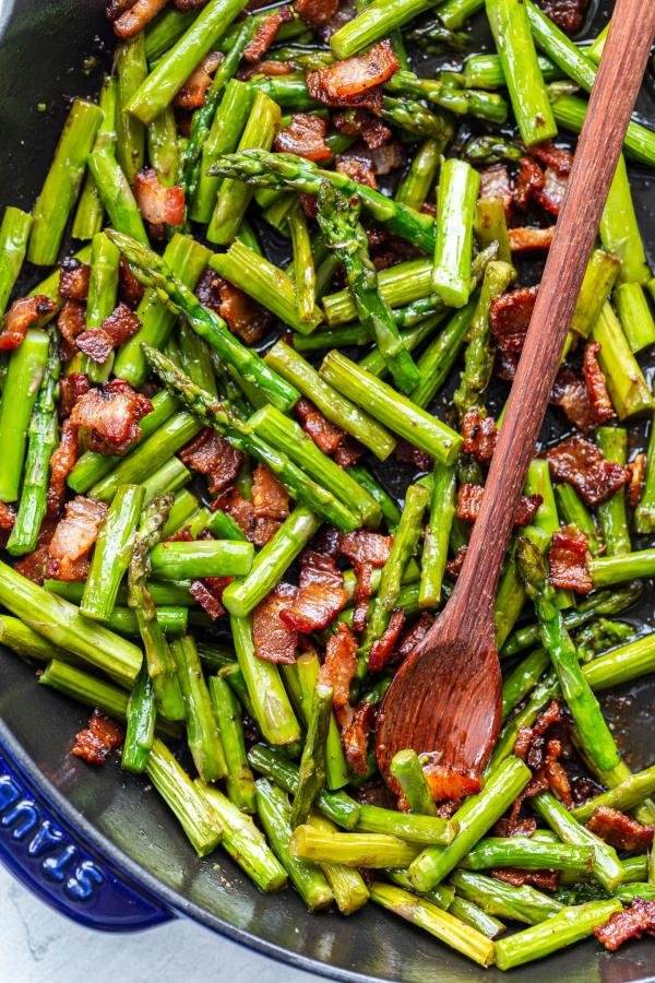 asparagus and bacon in a frying pan