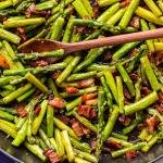 asparagus and bacon in a frying pan