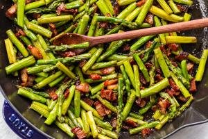 asparagus and bacon in a frying pan
