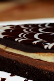 A slice of black tie mousse cake on a plate