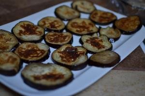 Cooked eggplant cut circles on plate