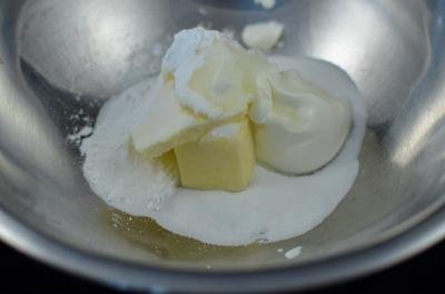 In a bowl butter, sugar, salt, baking powder and sour cream