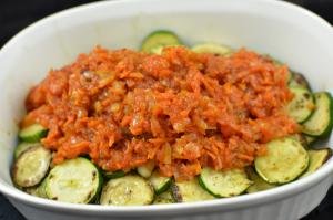 Mixture of carrots, onions and ketchup added on top of the zucchini slices