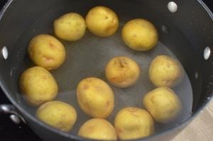 Potatoes in a pot filled with water on the stove