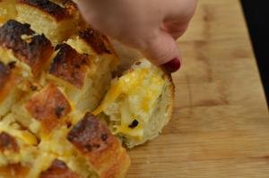Cheesy Bread Pulls on a cutting board
