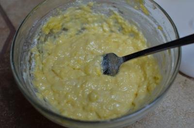 Egg yolks and flour mixed together in a bowl using a fork