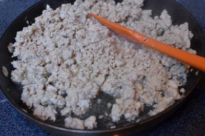 Ground chicken being cooked on a skillet