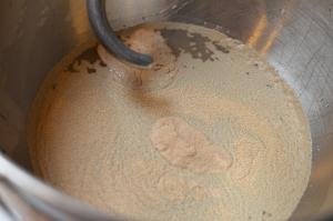 Sugar, water and yeast combined in a KitchenAid mixer