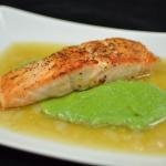 Salmon in Lemon Brodetto with Pea Puree on a plate