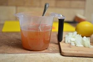 Lemon juice, zest and broth in a measuring cup