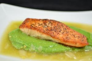 Salmon in Lemon Brodetto with Pea Puree on a plate