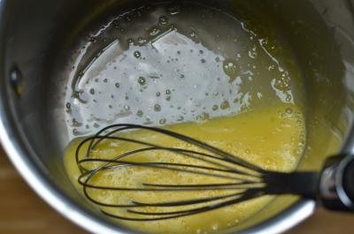 Milk, eggs and condensed milked been whisked together in a pot