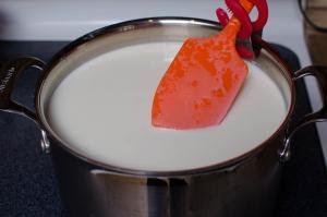 milk in large pot on a stove top