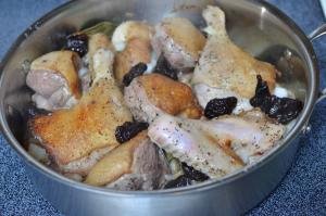 Prunes and onions added to the pan with the duck