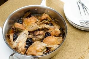 A pan with Roasted Duck with Prunes
