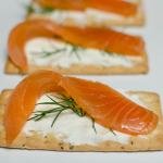 Cold Smoked Salmon on a cracker with cream cheese and dill