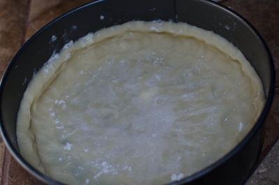 Raw tart crust in a 9-inch tart pan