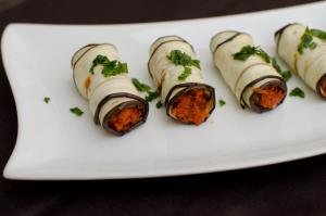 Eggplant Roll Up Appetizer on a long plate