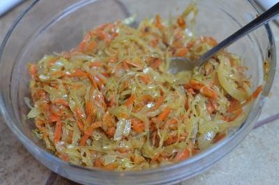Sautéed onions, carrots and cabbage in a bowl