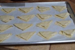 Puff Pastry Cheese Turnovers placed on a baking sheet lined with parchment paper