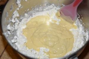 Mixing together the 2 parts for cake cream together in a large bowl using a spatula