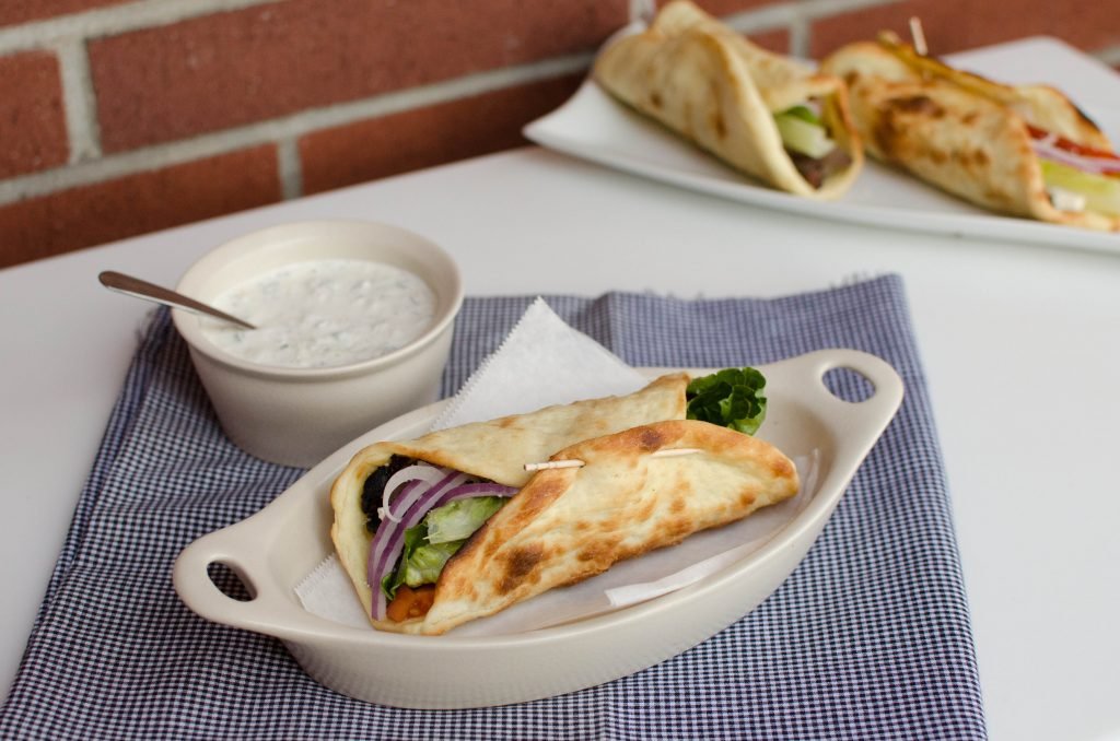 Gyro and Tzatziki Sauce on a table