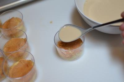Whipping cream and baileys liquor mixture poured over sponge cake