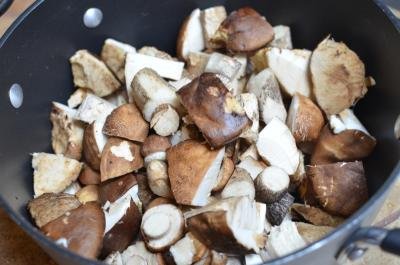 Mushrooms cut into pieces and placed into a pot