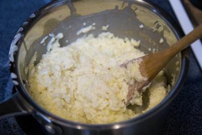 Mixture of rice and millet with milk in a saucepan